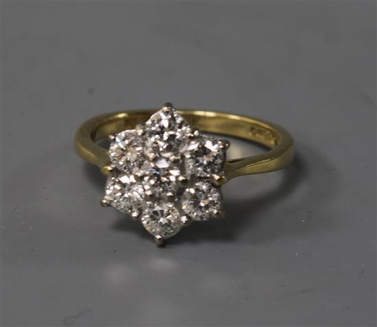 An 18ct gold and diamond cluster ring, size H.